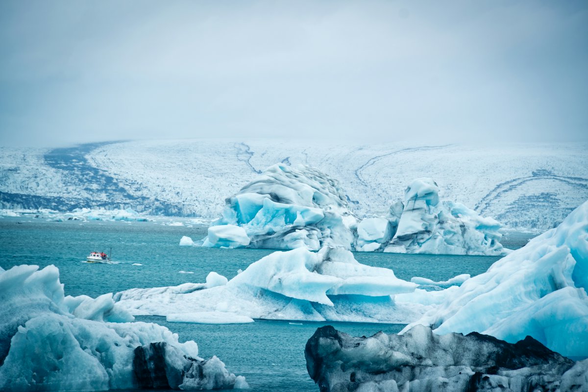 Blue icebergs floating in a glacier lagoon in Iceland