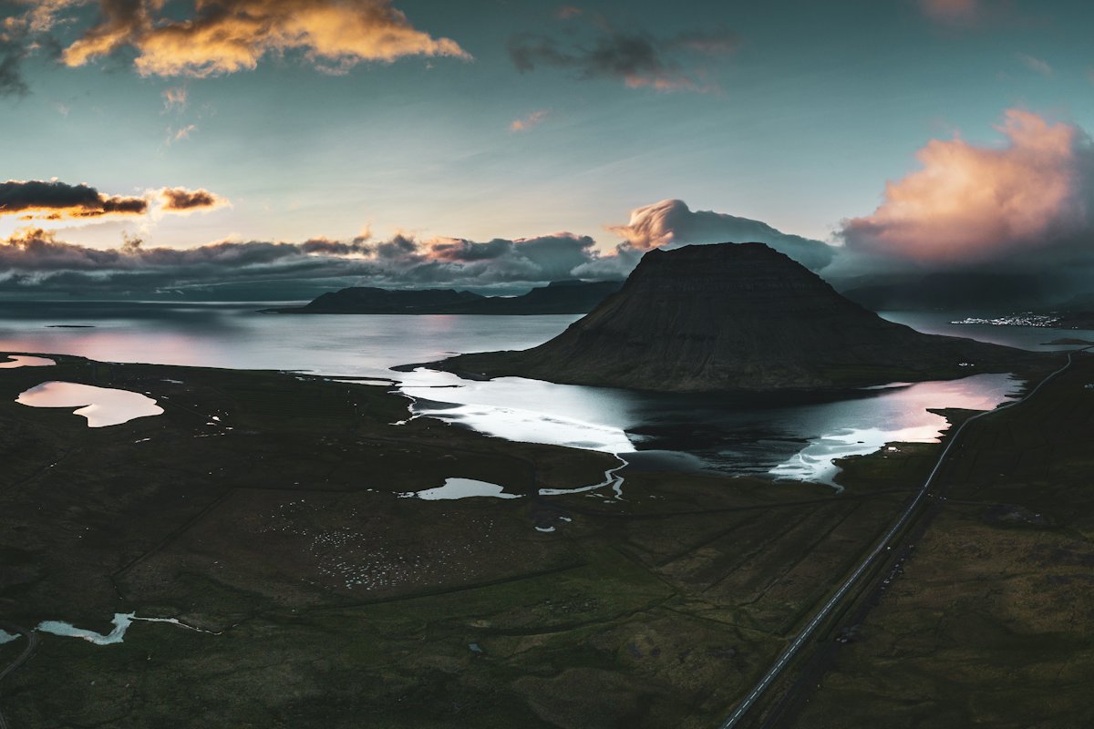Kirkjufell mountain behind the Kirkjufellsfoss waterfalls